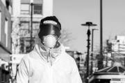 Street cleaner wearing protective gear