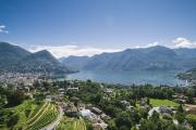 View of Franklin University in Lugano, Switzerland near lake and mountains