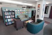 The lounge space in the department of Writing, Literature, and Publishing with chairs and bookshelves