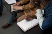 close up of student's hands and notebook during class at Emerson Los Angeles