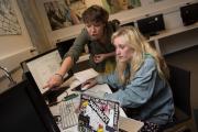 Students working together on a project on a computer