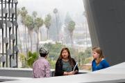 Emerson Los Angeles building outside with students standing against the cityscape