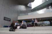 several students sitting on steps outside Emerson Los Angeles facility