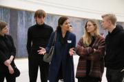 Professor with students in Paris museum