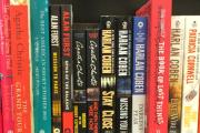 A bookshelf stacked with books