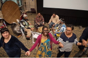People engaging in a dance during a heritage celebration