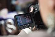 Student behind camera