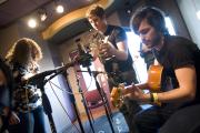 Student musicians and DJs in the WERS music studio