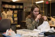 Student working on costume