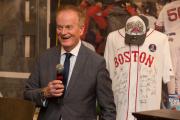 Faculty member standing in front of a Boston Red Sox jersey