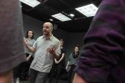 Teacher talking to students in the middle of a circle