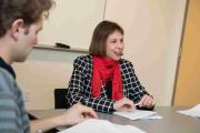 A faculty member sitting at a table