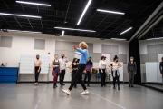 A group of tap dancers in a dance studio