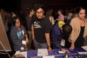 A group of people at a table at the career fair
