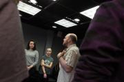 A faculty member talking to a group of students