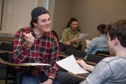 Students reviewing papers in pairs of two