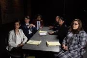 Panel of people sitting at the table