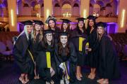 Group of students posing in cap and gowns