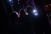 A group of three students in shadow