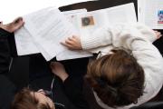 Overhead shot of students reviewing papers