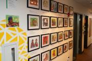A view of small artworks hanging on the wall as part of the Growing Up Roxbury exhibit.