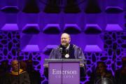 President Jay Bernhardt stands smiling behind a podium at his Investiture Ceremony.