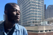 Photo of someone in front of a building