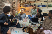 A group of people conversing at a table