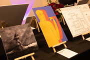 Three art pieces on a table