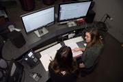 Two people sitting at a computer