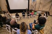 A group of students and Emerson College community members listening to a speaker in the Bordy Theater