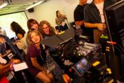 Students gathered in front a camera during a job fair at Emerson College