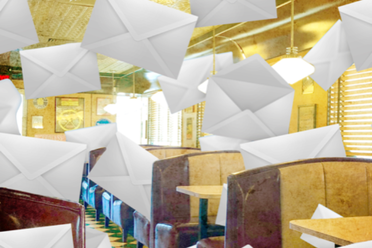 Large envelopes falling from the ceiling in a diner