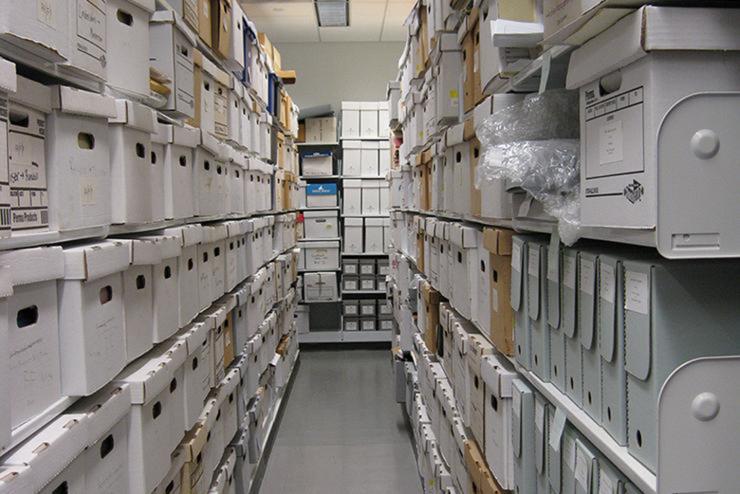 Aisle of Emerson archive with stacks of boxes