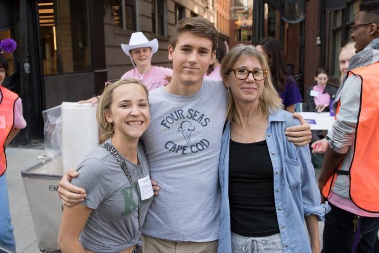 Student standing with relatives on move-in day at Emerson College