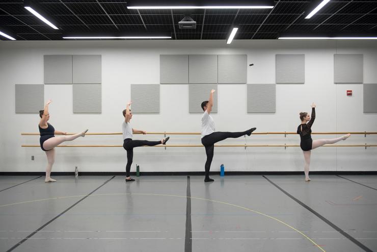 Students practicing ballet in ballet studio