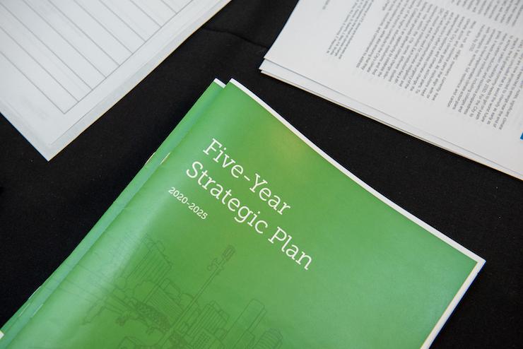 folder that reads "five year strategic plan"