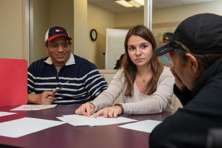 A graduate student works with adult clients in the Robbins Center