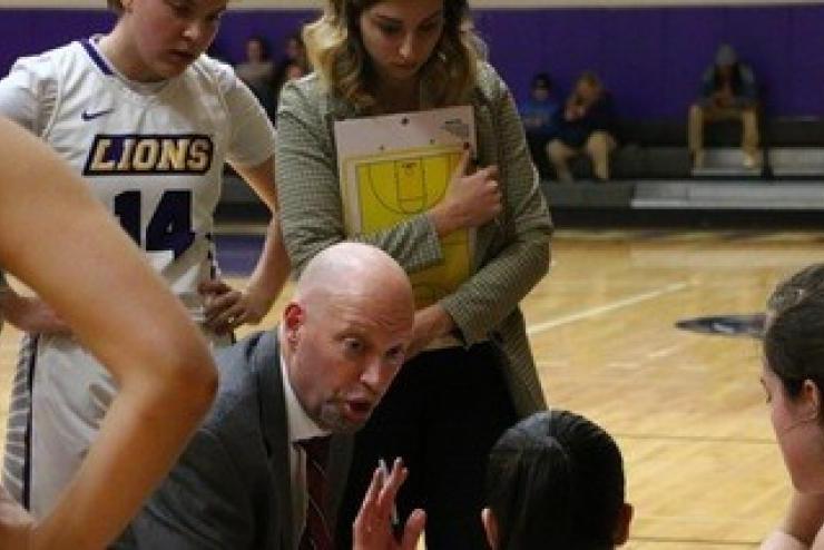 Coach with Emerson athletes