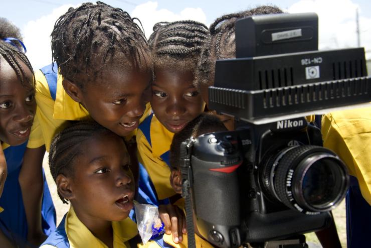 Young students looking through a Nikon camera