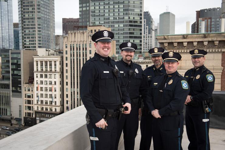 emerson police department poses on rooftop