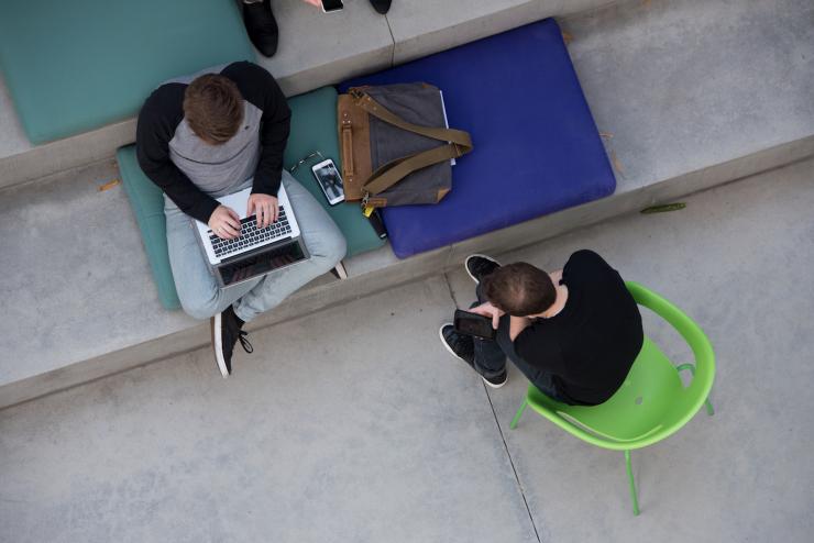 Aerial view of students on laptop in Emerson Los Angeles outdoor space
