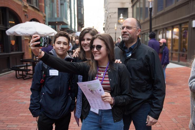 Family taking selfie while visiting Emerson's campus
