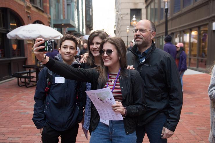student taking selfie with family while visiting Emerson's campus