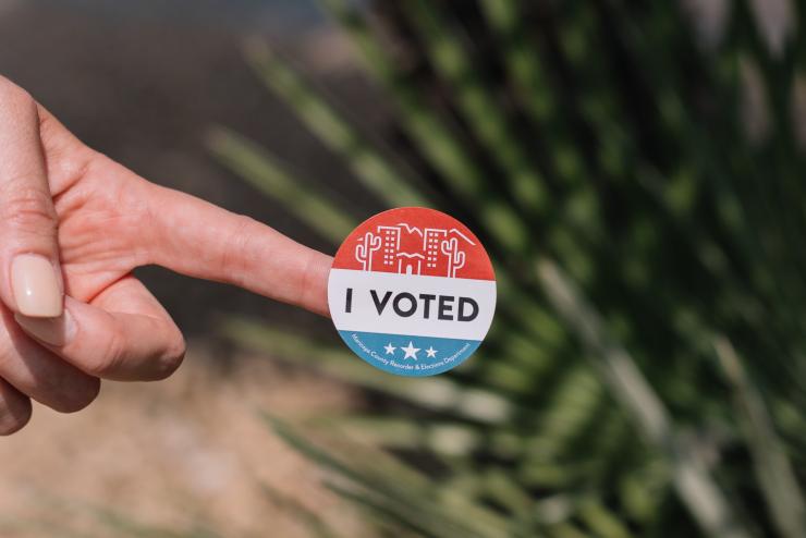 Person holding "I voted" sticker (Photo Credit to Phillip Goldsberry fron unsplash.com)
