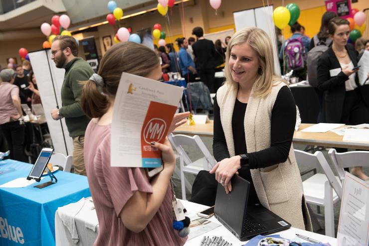 students network with potential employers at career and internship fair