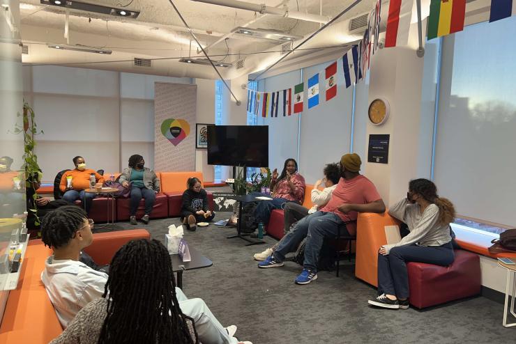 A group of students and faculty gathered in the Intercultural Student Affairs for a discussion