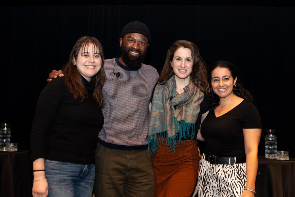 Four people pose for a photo