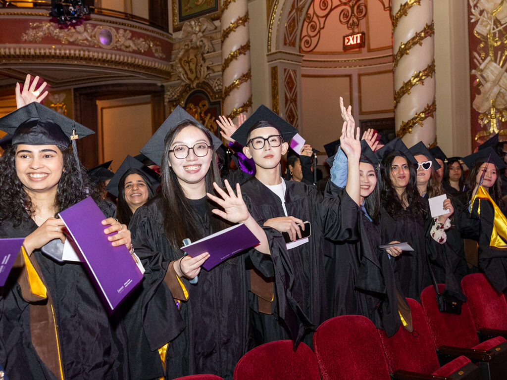 Graduates smile