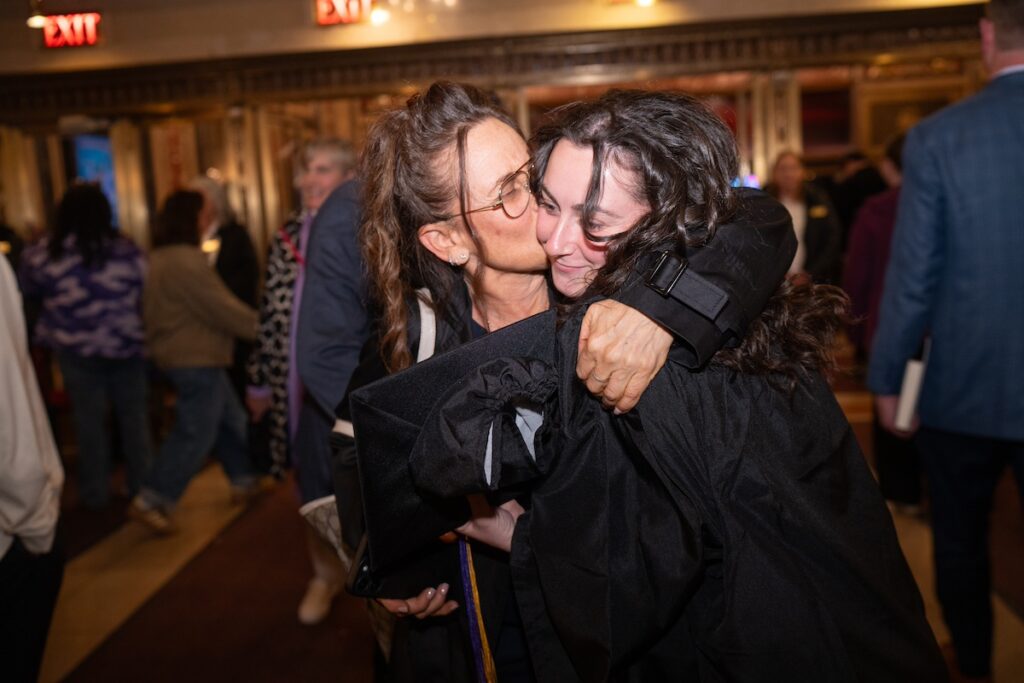 two people embrace
